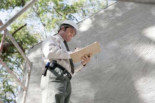 man looking at checklist