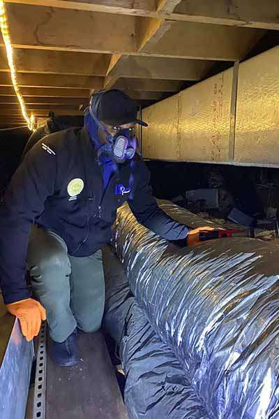 Checking a a crawl space during a home inspection