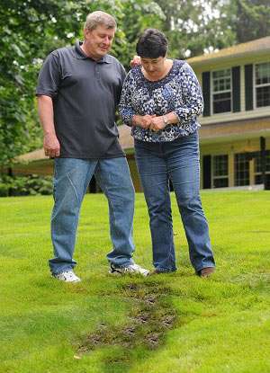 sad couple after septic failure