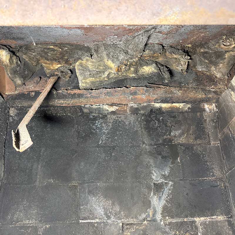 Heavy creosote buildup inside a fireplace firebox found during a Columbus, Ohio home inspection
