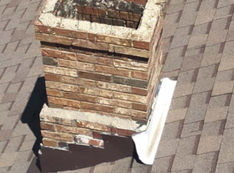 defect-home-inspection.jpg Chimney flashing defect identified during a roof inspection.