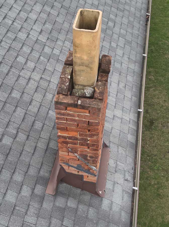 Chimney flue with no cap or spark arrester screen found during a Columbus, Ohio home inspection