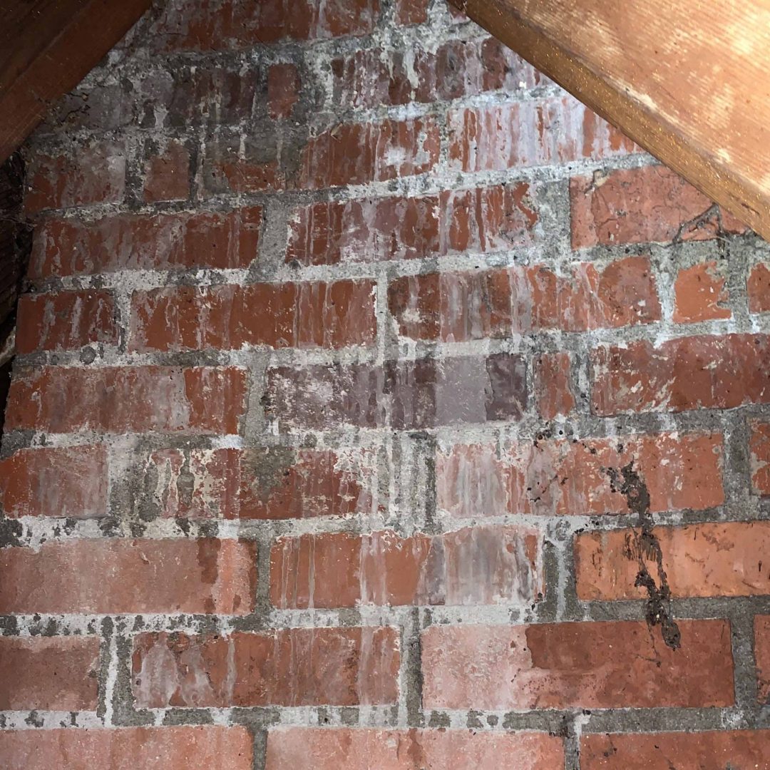 White mineral staining on chimney brick from moisture intrusion, found during a Columbus, Ohio home inspection