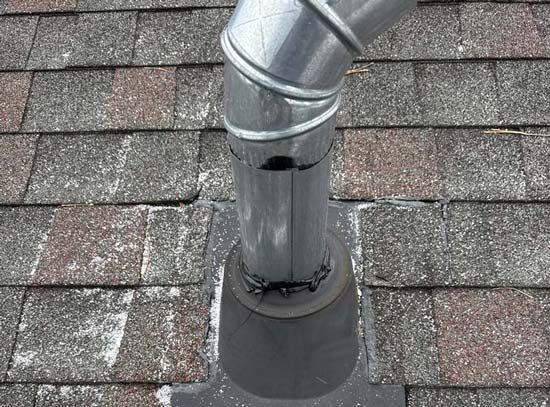 Deteriorated pipe boot identified during a roof inspection as a common roof defect.