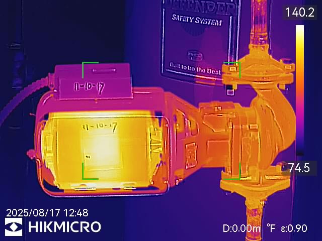 Thermal image of pump and motor assembly showing temperature differential indicating wear