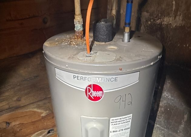 Aging water heater with corrosion found during a home inspection